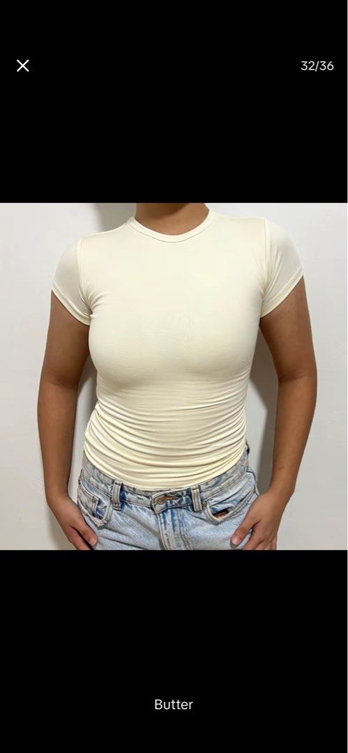 Cream Ruched T-shirt (Category: Shirts) located in Quezon City. Submitted by shaexlli (Listing ID 1446082286, Image 1). Description: - Cream colored t-shirt - Short sleeves - Ruched detail on the sides - Very stretchy material - Versatile: pairs well with jeans or skirts - Suitable for any occasion.