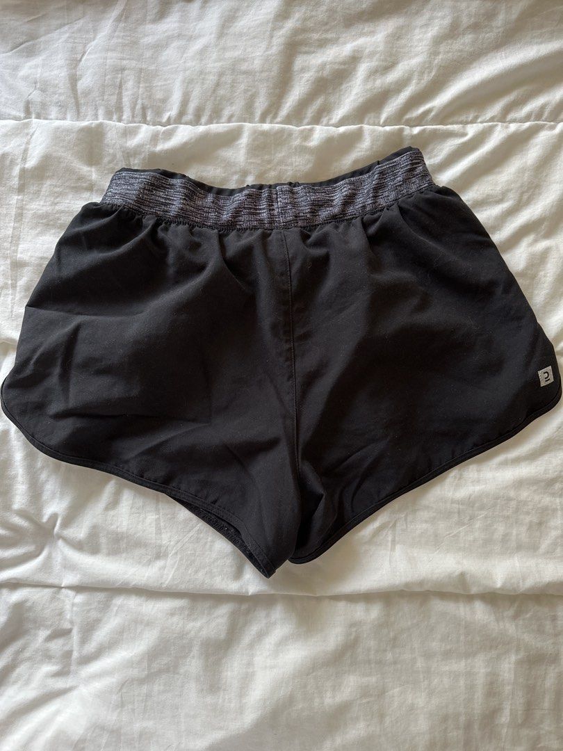 Decathlon Running Shorts Black XS (Category: Activewear) located in Manila. Submitted by rhaphina (Listing ID 1446051678, Image 2). Description: - Brand: Decathlon - Color: Black - Style: Running Shorts - Features: Elastic waistband with textured pattern, small logo detail on side - Material: Lightweight and breathable - Ideal for: Workouts, running, casual wear.
