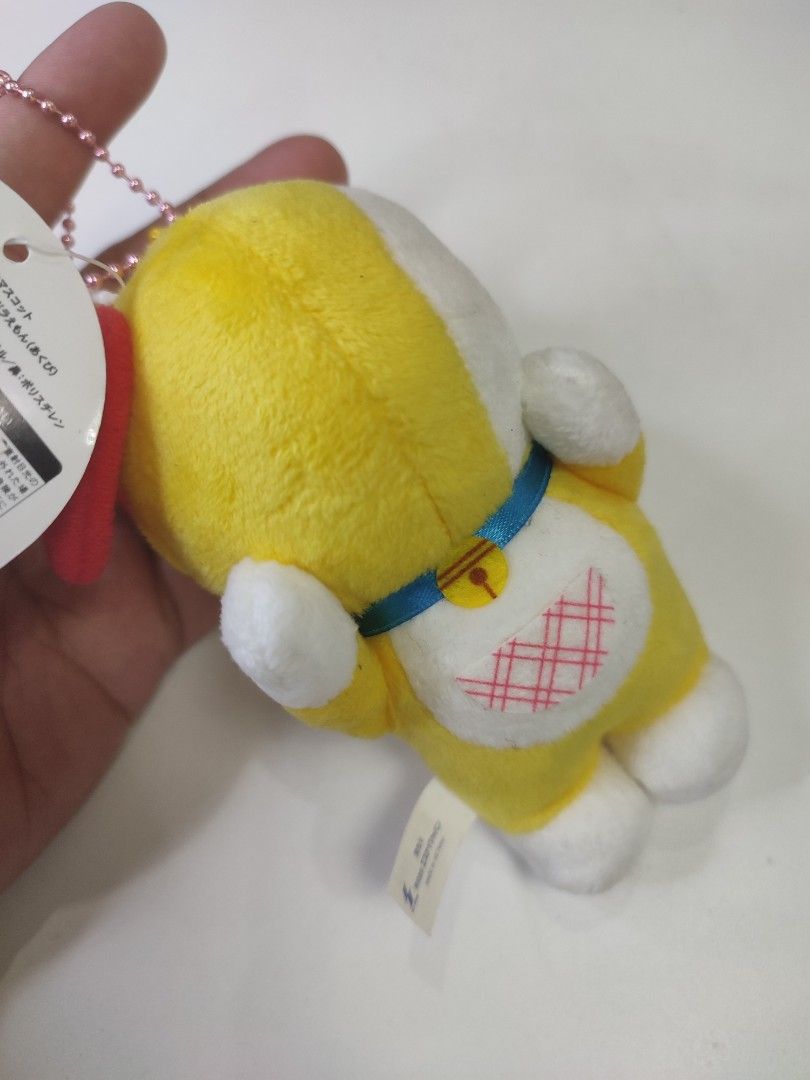 Doraemon Yellow Plush Toy Keychain with Tag (Category: Plushies & Soft Toys) located in Manila. Submitted by epicmountain-f20453 (Listing ID 1445989272, Image 2). Description: - Adorable yellow plush toy keychain - Features a cute red bow on top - Comes with a blue collar and bell - Original tag still attached - Approximately 4 inches in length - Ideal for decorating bags or as a collectible - A must-have for Doraemon enthusiasts!.