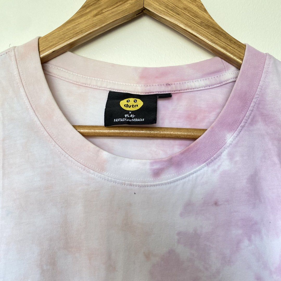 DVTN Smiley Tie-Dye T-Shirt (Category: Tshirts & Polo Shirts ) located in Cavite. Submitted by branchee_chic (Listing ID 1446065668, Image 2). Description: 💕L-XL 💕Need wash 💕This is UKAY! Please Manage your expectations. Thank you!:) - DVTN Tie-Dye T-Shirt - Unique pastel pink, purple, and blue tie-dye pattern - Features a cheerful yellow smiley face graphic - Made from 100% comfortable cotton - Perfect for stylish, casual everyday wear.