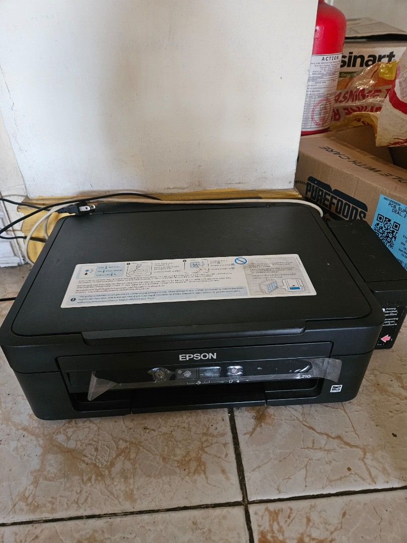 Epson L210 (Defective/Broken) (Category: Printers, Scanners & Copiers) located in Calasiao. Submitted by carlpua03 (Listing ID 1445994282, Image 2). Description: Selling Defective Epson L210 Printer Defect: Can not print, but can still scan (Shipping Fee to be shouldered by buyer).