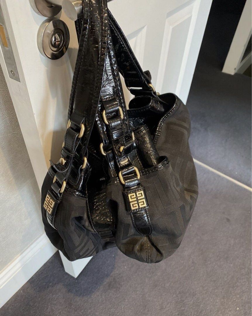 Givenchy Black Canvas Monogram Shoulder Bag (Category: Luxury Bags & Wallets) located in Cainta. Submitted by cetairesvintage (Listing ID 1446019711, Image 3). Description: - Authentic Givenchy shoulder bag in black. - Features the signature all-over Givenchy monogram pattern. - Elegant patent leather accents on straps and trim. - Stylish gold hardware details. - Comes complete with original dust bag and box. - Ideal for everyday use, adding a to