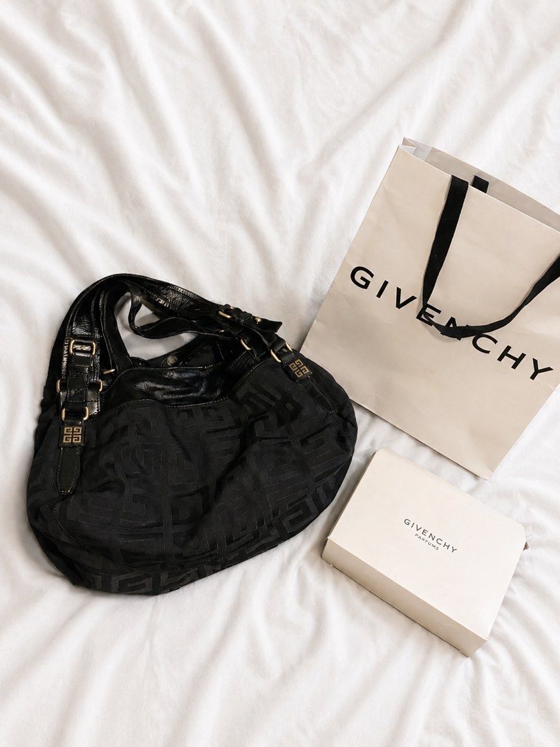 Givenchy Black Canvas Monogram Shoulder Bag (Category: Luxury Bags & Wallets) located in Cainta. Submitted by cetairesvintage (Listing ID 1446019711, Image 1). Description: - Authentic Givenchy shoulder bag in black. - Features the signature all-over Givenchy monogram pattern. - Elegant patent leather accents on straps and trim. - Stylish gold hardware details. - Comes complete with original dust bag and box. - Ideal for everyday use, adding a to