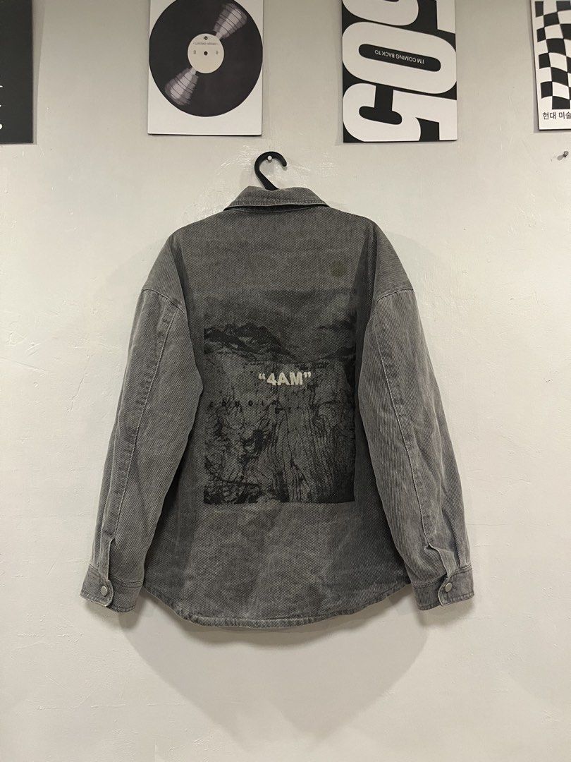 Grey Denim Jacket "4AM" Graphic Print (Category: Coats, Jackets and Outerwear) located in Paranaque City. Submitted by mrthingsman (Listing ID 1446134322, Image 2). Description: - Grey washed denim jacket - Graphic '4AM' print on the back - Two chest pockets with button closure - Button-up front - Relaxed fit - Ideal for layering.