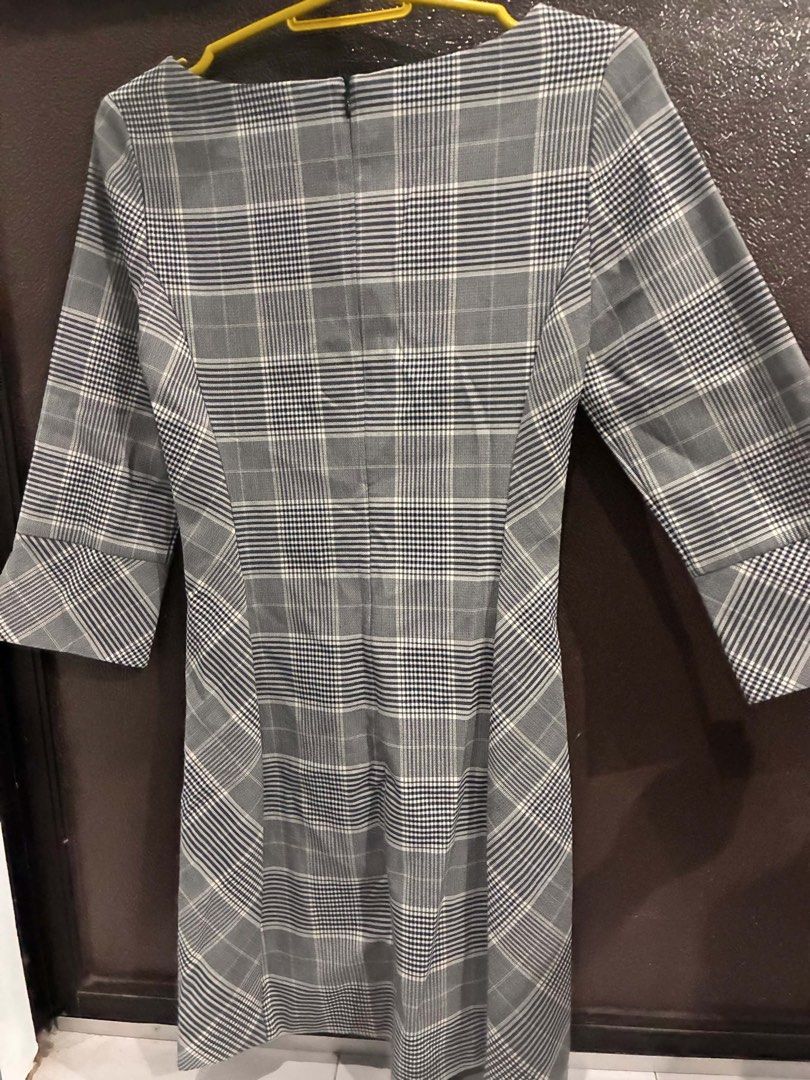 Grey Plaid 3/4 Sleeve Dress (Category: Dresses) located in Quezon City. Submitted by mnqfinds (Listing ID 1446112697, Image 2). Description: - Classic grey plaid pattern - Flattering cut - 3/4 sleeves with a slight flare - Convenient back zipper closure - Versatile for work or casual outings.