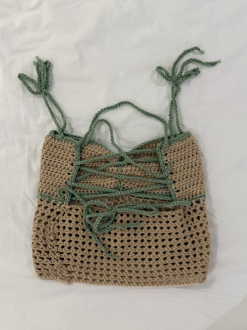 Handmade Crochet Crop Top with Tie Back (Category: Sleeveless) located in Makati City. Submitted by oursummerstitches (Listing ID 1446111336, Image 2). Description: - Cute handmade crochet crop top - Colors: Tan and Green - Adjustable tie-back closure - Unique mesh-like pattern at the bottom - Ideal for summer wear or layering - Truly a unique piece!.