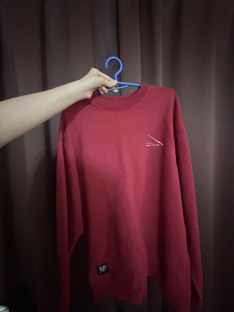 Harry Potter Red Sweater / Sweatshirt (Category: Longsleeves) located in Muntinlupa City. Submitted by buuttercup (Listing ID 1446161957, Image 2). Description: Red Harry Potter graphic tee sweatshirt purchased from Spao Korea No flaws! Fabric is not thin - Wand designs on the back - Small logo on the front - Size M (170/92A).