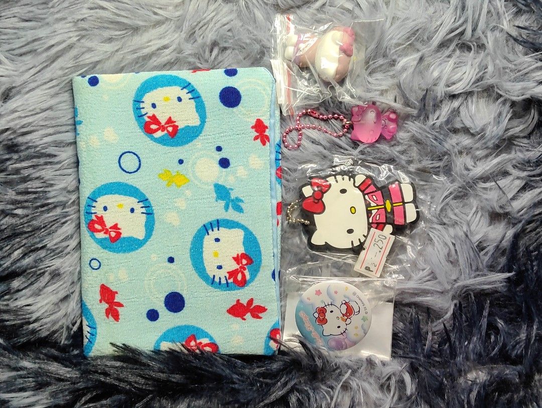 Hello Kitty Keychain, PIN and tissue holder (Category: Character Goods) located in Pasig City. Submitted by hazelscollectibles (Listing ID 1446047072, Image 1). Description: - Adorable Kitty set perfect for collectors and fans. tissue holder 85 gundam x hello kitty keychain 180 pin 65 pink keychain 130 figure 175 - Includes a stylish fabric notebook with a blue and white Kitty design. - Features a unique Gundam x Kitty keychain. - Comes with a cu