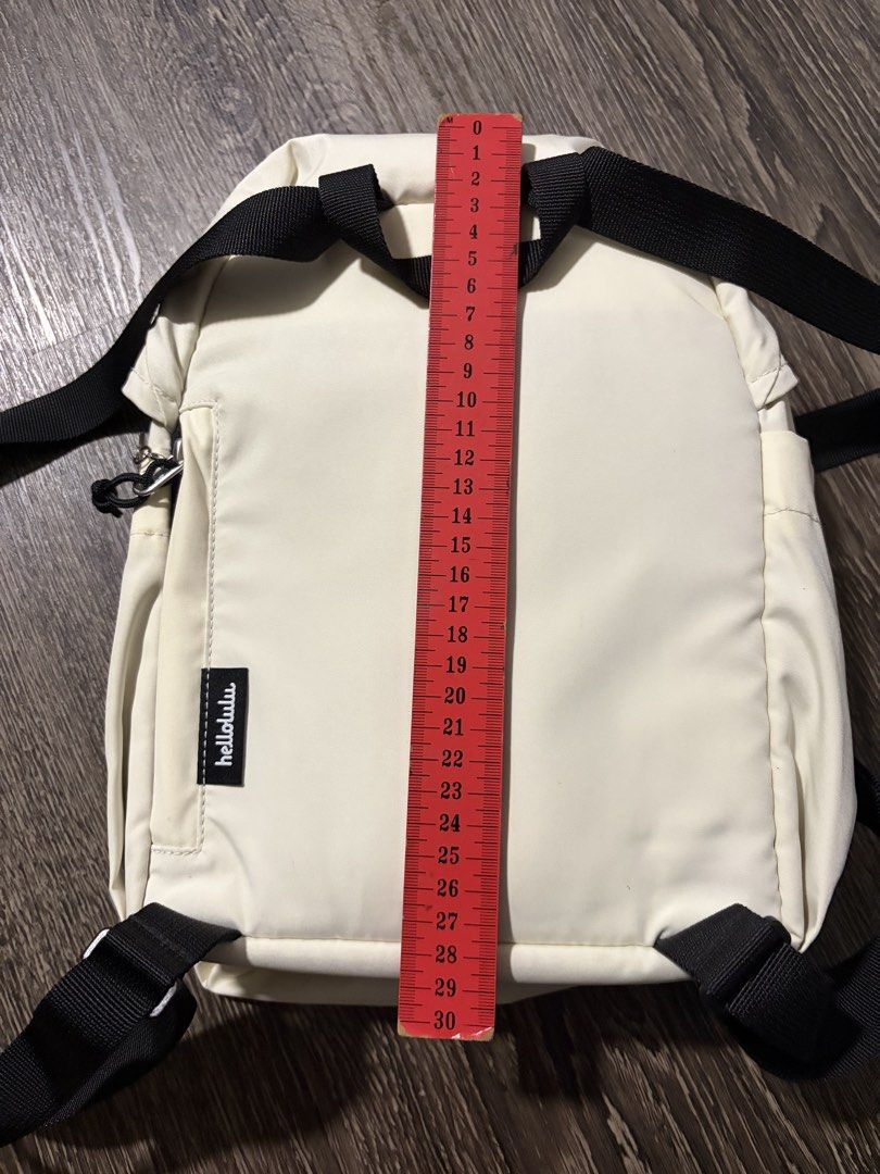 hellolulu Cream Drawstring Backpack (Category: Backpacks) located in Singapore. Submitted by newcat714 (Listing ID 1446033887, Image 2). Description: - Brand: hellolulu - Color: Cream - Closure: Drawstring top - Exterior: Side pockets - Interior: Multiple compartments - Size: Approx. 30cm (H) x 25cm (W) - Ideal for: Daily essentials.