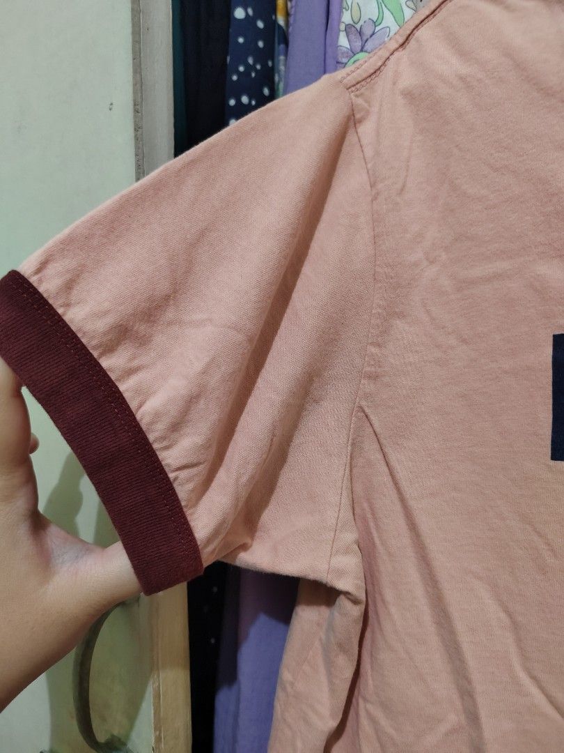 Human 1999 Pink Ringer T-shirt (Category: Shirts) located in Manila. Submitted by jadmcl (Listing ID 1446140287, Image 3). Description: - Pink t-shirt with 'HUMAN 1999' graphic print - Navy blue ringer neckline - Maroon sleeve cuffs - Simple and casual design - Ideal for everyday wear.