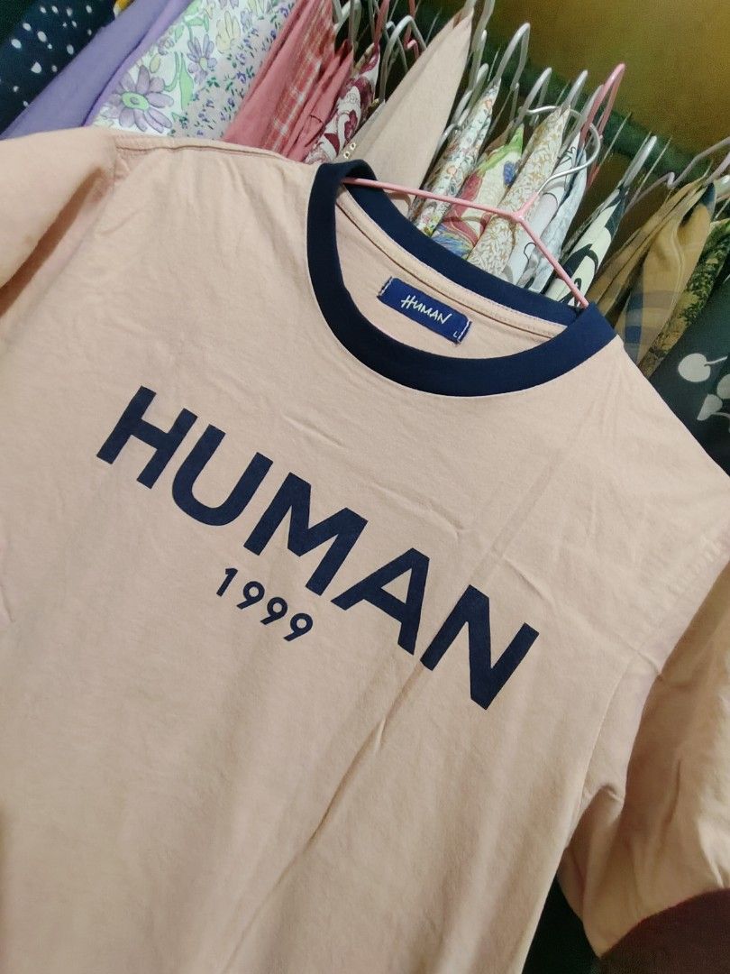 Human 1999 Pink Ringer T-shirt (Category: Shirts) located in Manila. Submitted by jadmcl (Listing ID 1446140287, Image 2). Description: - Pink t-shirt with 'HUMAN 1999' graphic print - Navy blue ringer neckline - Maroon sleeve cuffs - Simple and casual design - Ideal for everyday wear.