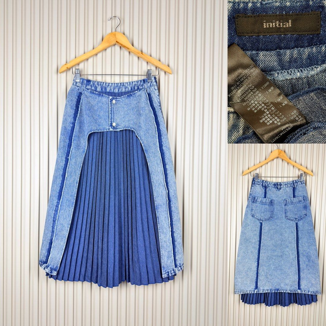 Initial Denim Pleated Midi Skirt (Category: Skirts) located in Pasig City. Submitted by trendapparelph (Listing ID 1446095717, Image 1). Description: - Acid wash denim midi skirt - Features a pleated blue underskirt - Unique front cut-out design - Two functional back pockets - Perfect statement piece for any outfit Dimensions: 25-26 waist frame 31" length.