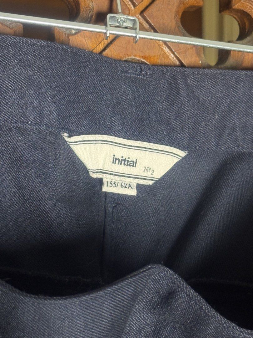 Initial N°2 Navy Blue Plaid Wrap Skirt with Adjustable Belt (Category: Skirts) located in Quezon City. Submitted by EveryWANTShop (Listing ID 1446093780, Image 3). Description: - Navy blue wrap skirt - Contrasting plaid front panel - Adjustable buckle belt - Two back pockets - Estimated size: 155/62A - Versatile for casual and smart casual looks.