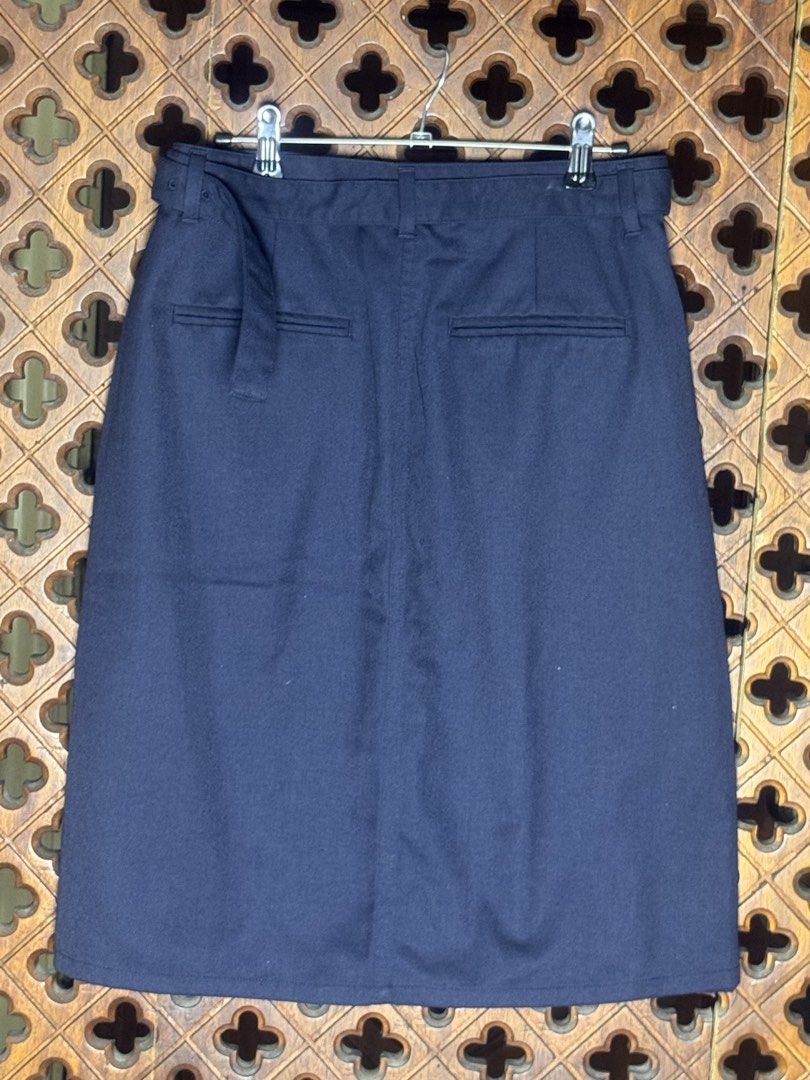 Initial N°2 Navy Blue Plaid Wrap Skirt with Adjustable Belt (Category: Skirts) located in Quezon City. Submitted by EveryWANTShop (Listing ID 1446093780, Image 2). Description: - Navy blue wrap skirt - Contrasting plaid front panel - Adjustable buckle belt - Two back pockets - Estimated size: 155/62A - Versatile for casual and smart casual looks.