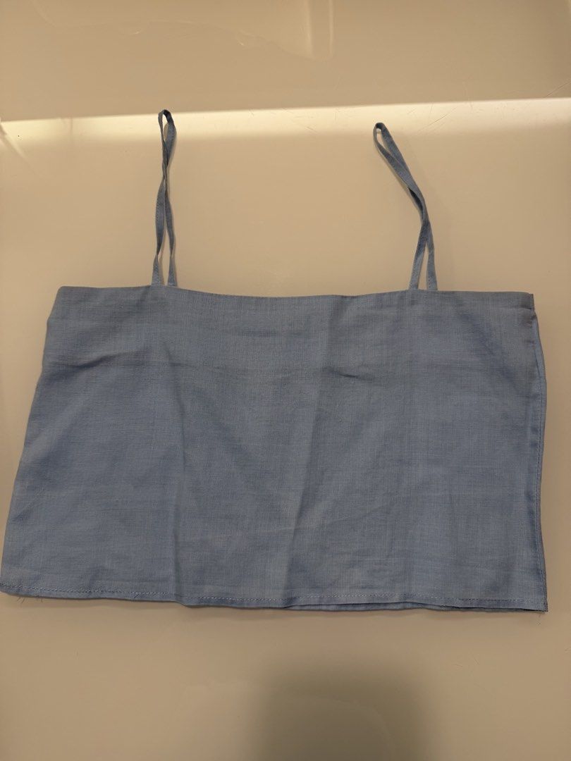 Kaia Light Blue Linen Blend Crop Top (Category: Others Tops) located in Makati City. Submitted by shopbb (Listing ID 1446083758, Image 1). Description: - Light blue crop top from Kaia - Made from a comfortable linen blend fabric - Features adjustable straps for a perfect fit - Simple and breezy design, perfect for any occasion - Versatile for layering or wearing solo.