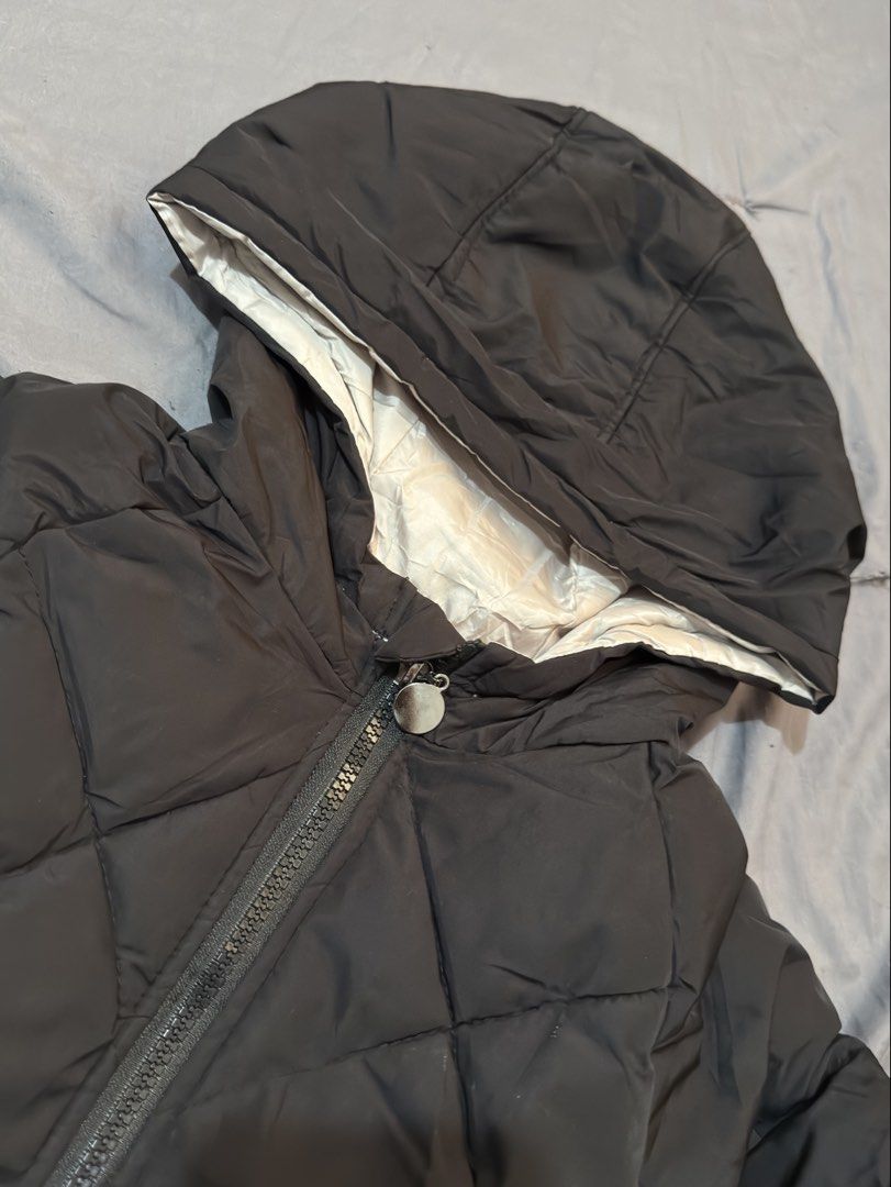 Kids 130 Puffer Jacket with Hood (Category: Babies & Kids Fashion) located in Muntinlupa City. Submitted by thechicknit (Listing ID 1445996488, Image 2). Description: - Kids' puffer jacket, size 130 - Stylish diamond quilted pattern - Attached hood for extra warmth - Easy zipper closure - Cozy light cream colored lining - Ideal for chilly weather.
