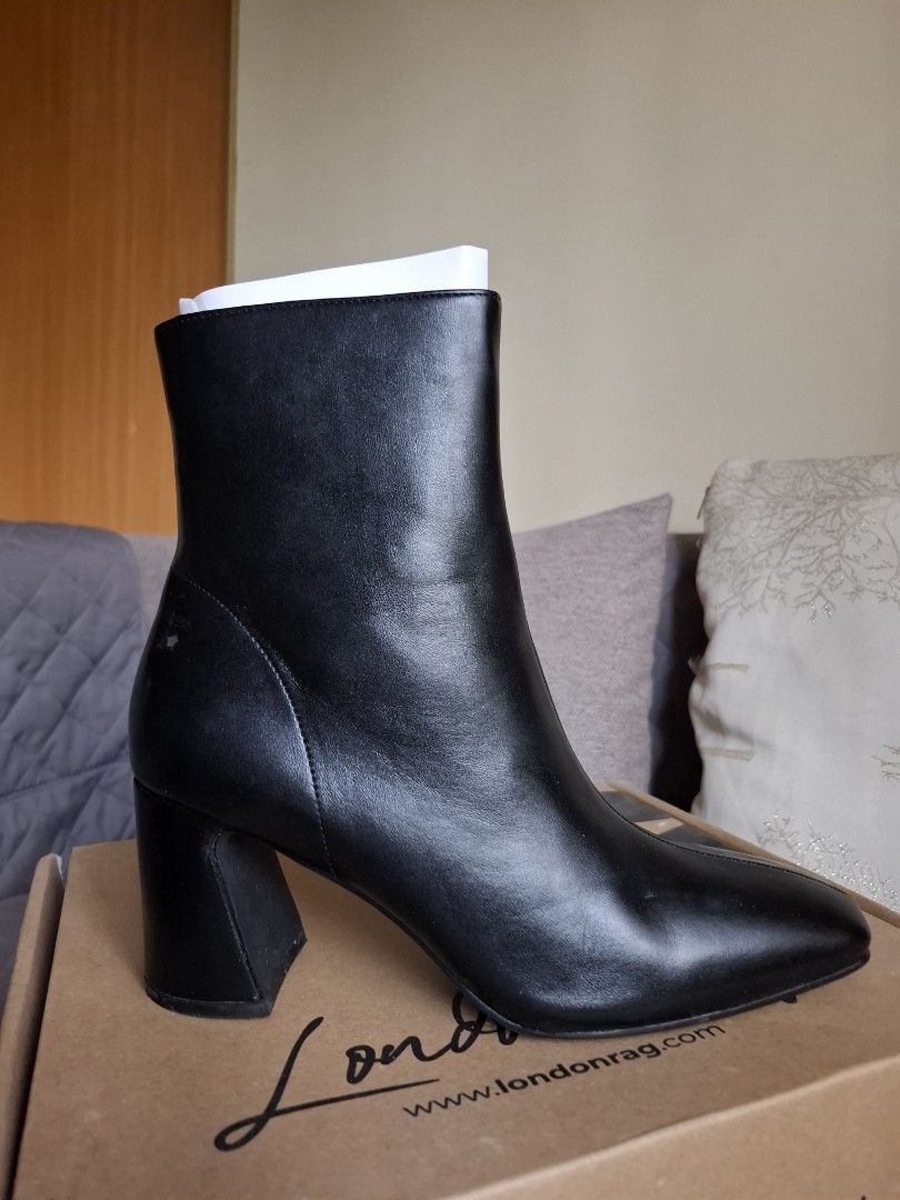 London Rag Boots (Category: Boots) located in San Fernando. Submitted by raiaea (Listing ID 1446061541, Image 2). Description: - Type: Boots - Upper Material: Faux Leather - Outer Sole: TPR - Closed Square Toe - Side Zipper Closure - Triangular Block Heels - Heel Height: 3 inches Size: US 7 | EU 38 | 24.5 cm Used once with socks and rumampa lang sa bahay. Not yet used outside. Check photos for flaw. The whites on the picture can still be cleaned 