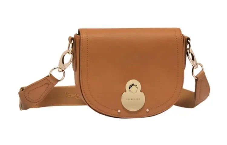 Longchamp Cavalcade Crossbody Bag Small Tan (Category: Luxury Bags & Wallets) located in Rizal. Submitted by peydaysale (Listing ID 1446118257, Image 1). Description: - Authentic Longchamp saddle bag - Rich tan leather - Elegant gold hardware details - Adjustable strap with buckle for a custom fit - Timeless and clean design - Perfect for everyday errands or evening events.
