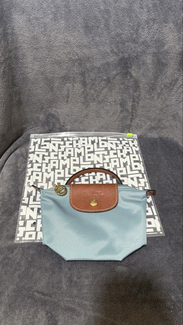 Longchamp Le Pliage Pouch (Category: Purses & Pouches) located in Dagupan City. Submitted by kthabc (Listing ID 1445991144, Image 1). Description: Original, bought from japan Brandnew.
