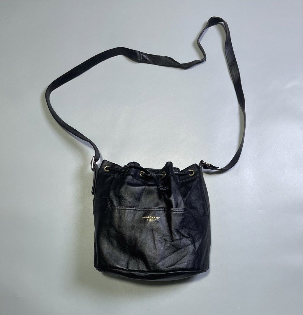 Longchamp Paris Black Leather Drawstring Bucket Bag (Category: Luxury Bags & Wallets) located in Zamboanga. Submitted by laffthrift_23 (Listing ID 1446141978, Image 1). Description: - Authentic Longchamp Paris black leather bucket bag - Secure drawstring closure - Adjustable shoulder strap for comfort - Classic and versatile for everyday wear.