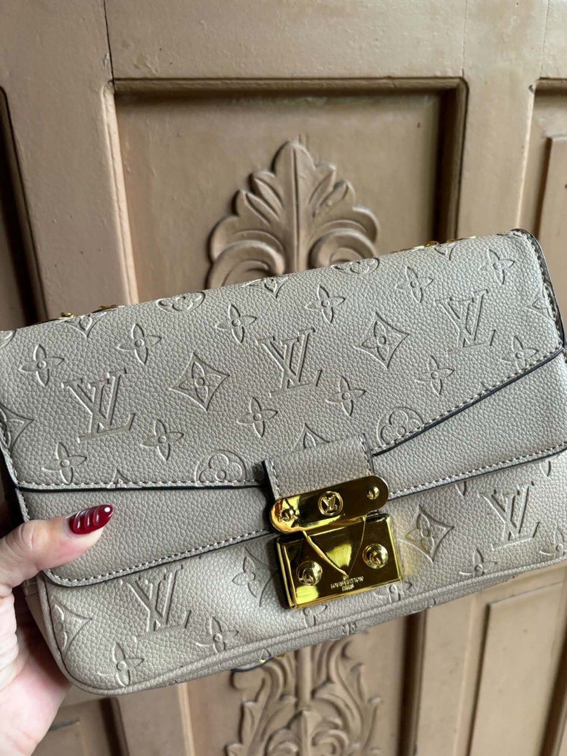 Louis Vuitton Monogram Empreinte Pochette Metis Bag (Category: Luxury Bags & Wallets) located in Manila. Submitted by graciouslygraceee (Listing ID 1445998986, Image 2). Description: - Authentic Louis Vuitton Pochette Metis - Iconic Monogram Empreinte design - Elegant gold chain strap and hardware - Interior zip pocket and main compartment - Convenient back exterior zip pocket - Versatile for day or night use.