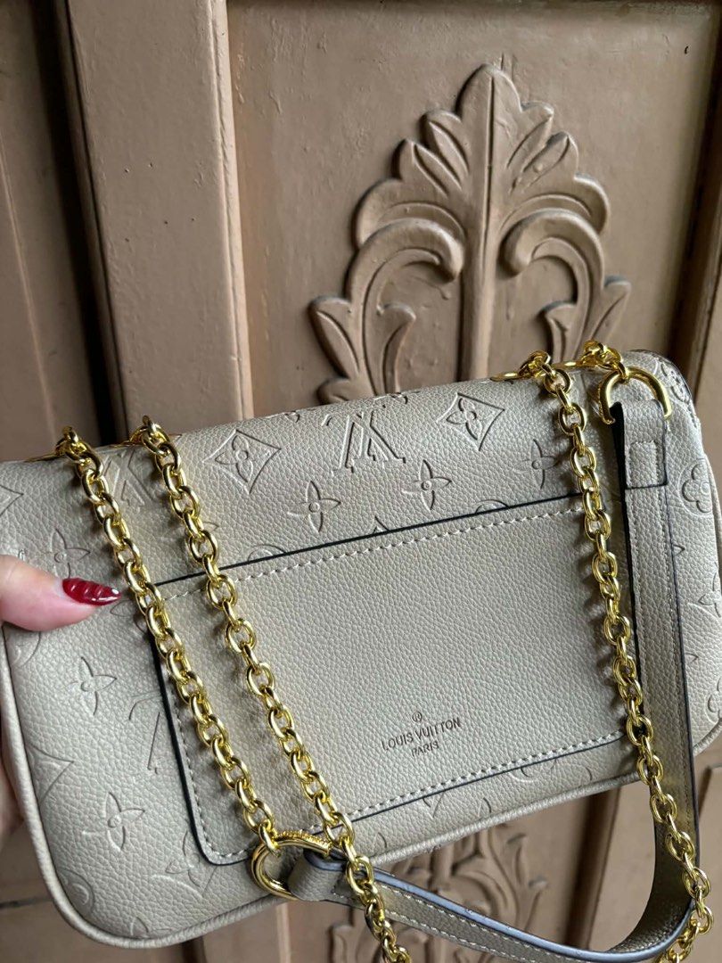 Louis Vuitton Monogram Empreinte Pochette Metis Bag (Category: Luxury Bags & Wallets) located in Manila. Submitted by graciouslygraceee (Listing ID 1445998986, Image 3). Description: - Authentic Louis Vuitton Pochette Metis - Iconic Monogram Empreinte design - Elegant gold chain strap and hardware - Interior zip pocket and main compartment - Convenient back exterior zip pocket - Versatile for day or night use.