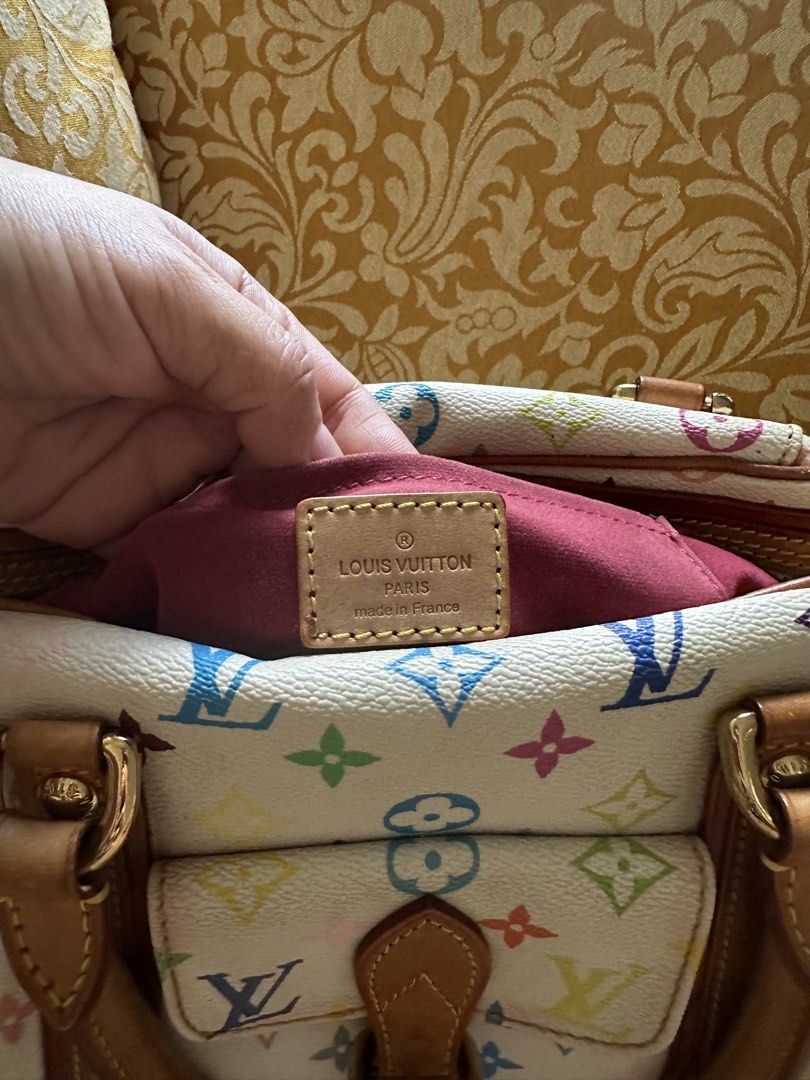 Louis Vuitton Monogram Multicolore Speedy 30 (Category: Luxury Bags & Wallets) located in Taguig. Submitted by ireneria1984 (Listing ID 1445987356, Image 2). Description: - Authentic Louis Vuitton Speedy 30 - Monogram Multicolore canvas (white with colorful LV logos & flowers) - Genuine leather trim and handles - Secure zipper closure - Interior pockets for organization - Made in France - Iconic and collectible LV piece.