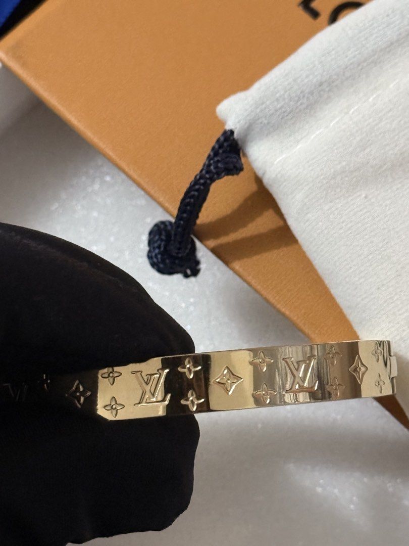 Louis Vuitton Nanogram Bracelet (Category: Luxury Accessories) located in Manila. Submitted by adivathrift (Listing ID 1446093530, Image 3). Description: Louis Vuitton Nanogram Bracelet elegant gold-tone cuff bracelet with embossed LV monogram details all around. It has a sleek, classy finish that’s easy to wear alone or stacked with other accessories. Thrifted from Europe. Authenticity is unverified. Selling as is based on photos. AdivaThrift.ph