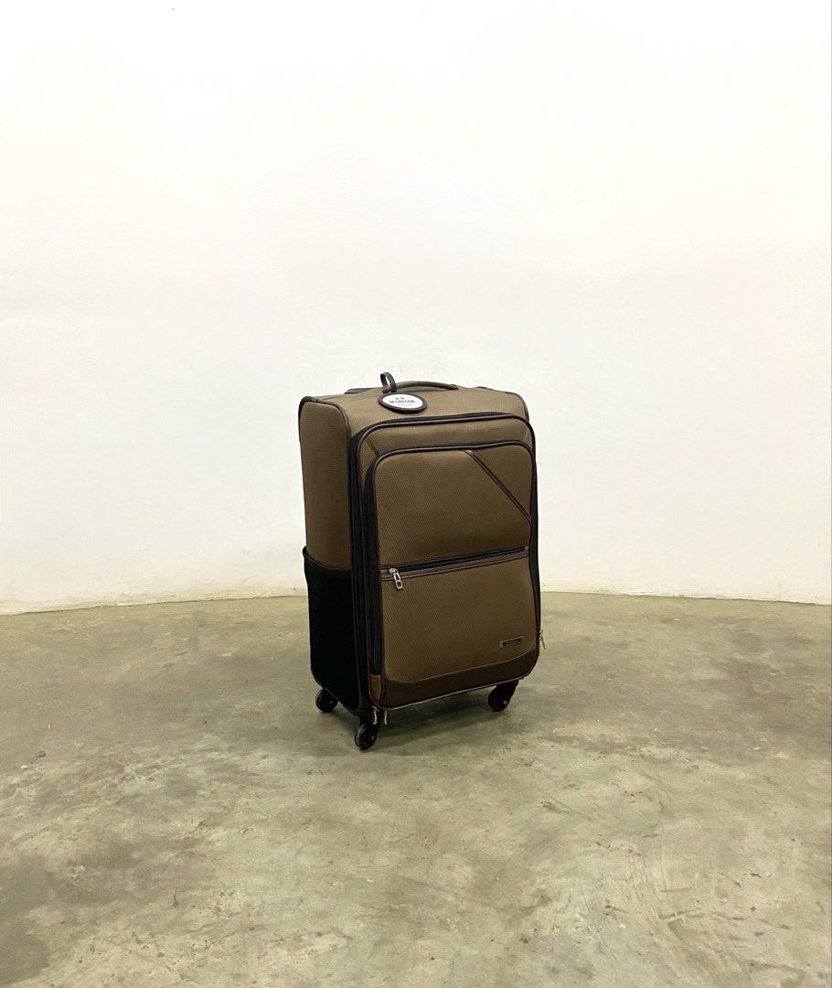 McGregor New York Brown Rolling Suitcase Luggage (Category: Luggage) located in Santa Rosa. Submitted by annie_annie83 (Listing ID 1446146711, Image 2). Description: - Brand: Brown McGregor New York - Type: Rolling Suitcase - Dimensions: Approximately 20 inches tall - Features: Retractable handle, wheels for easy transport, front zippered pocket, side pocket - Ideal for: Travel.