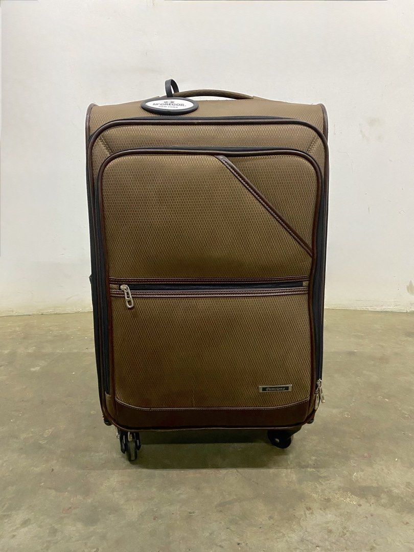 McGregor New York Brown Rolling Suitcase Luggage (Category: Luggage) located in Santa Rosa. Submitted by annie_annie83 (Listing ID 1446146711, Image 3). Description: - Brand: Brown McGregor New York - Type: Rolling Suitcase - Dimensions: Approximately 20 inches tall - Features: Retractable handle, wheels for easy transport, front zippered pocket, side pocket - Ideal for: Travel.