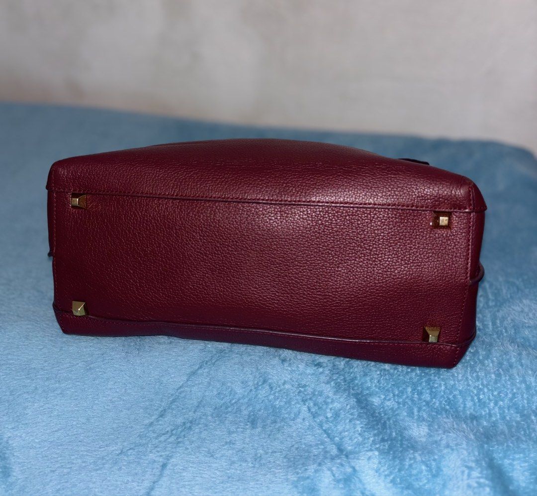 MCM Burgundy Leather Top Handle Bag (Category: Luxury Bags & Wallets) located in Bago City. Submitted by christiaaan0515 (Listing ID 1446036291, Image 3). Description: - Rich burgundy leather handbag - In excellent condition - missing sling - Elegant gold hardware details - Comfortable top handle - Secure flap closure - Multiple interior compartments for organization - Ideal for both daily use and special occasions - A timeless, classic accessory