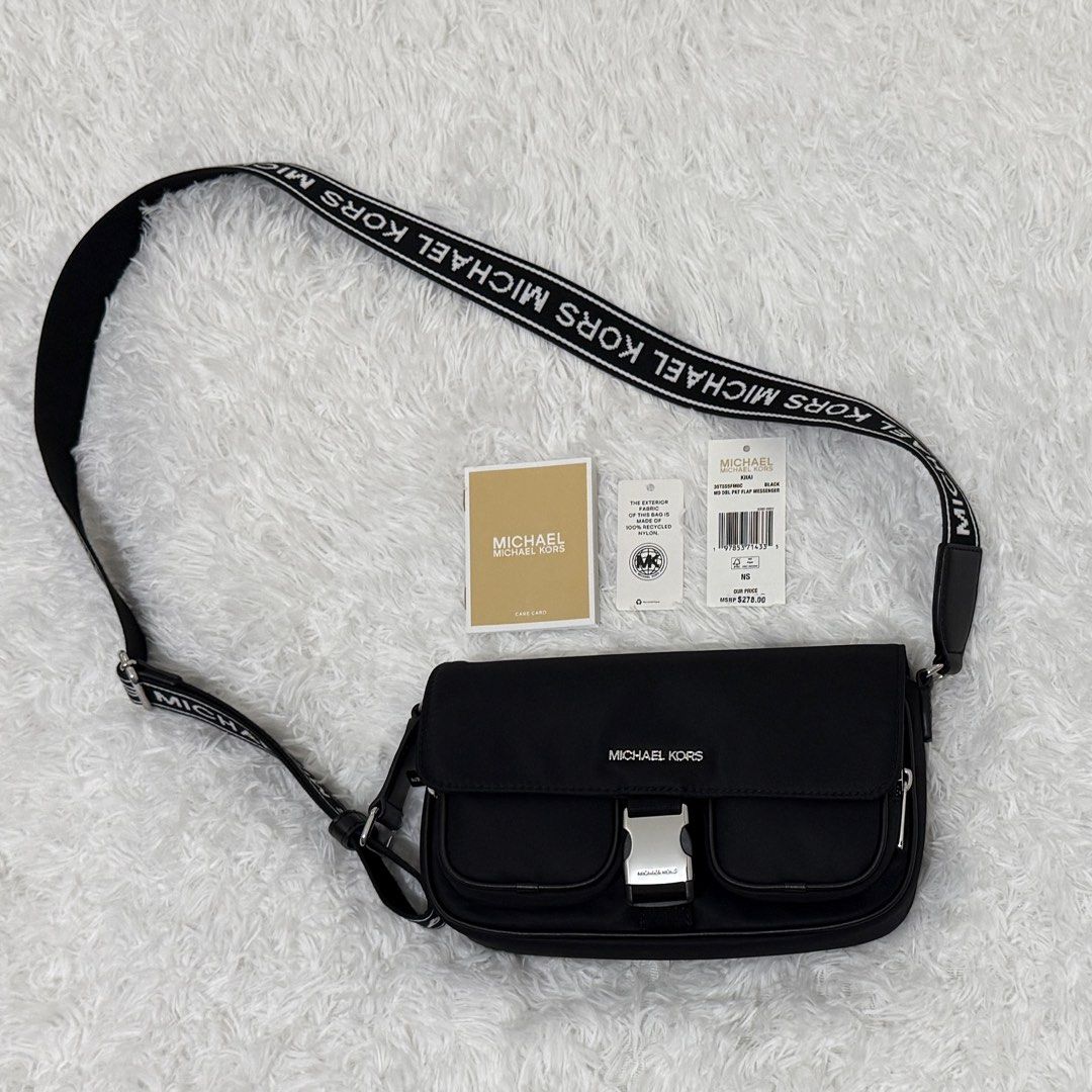 Michael Kors Khai Medium Nylon Messenger Bag Black (Category: Luxury Bags & Wallets) located in Manila. Submitted by paaaaat_2021 (Listing ID 1446052723, Image 1). Description: Michael Kors Khai Nylon Messenger Bag - original, black - like new, used twice - with care card and tag, no paper bag RFS: declutter P3,800 + SF (slightly negotiable).