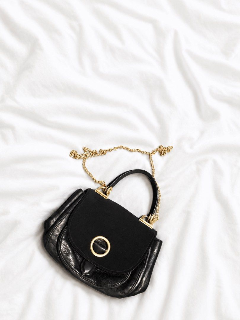 MK Black Leather Quilted Chain Shoulder Bag (Category: Luxury Bags & Wallets) located in Cainta. Submitted by cetairesvintage (Listing ID 1446079931, Image 3). Description: MK KORRA BAG NOTE: the chains is not the original I lost it - Elegant gold hardware - Stylish quilted pattern on front flap - Versatile top handle and long gold chain strap - Ideal for both everyday use and nights out.