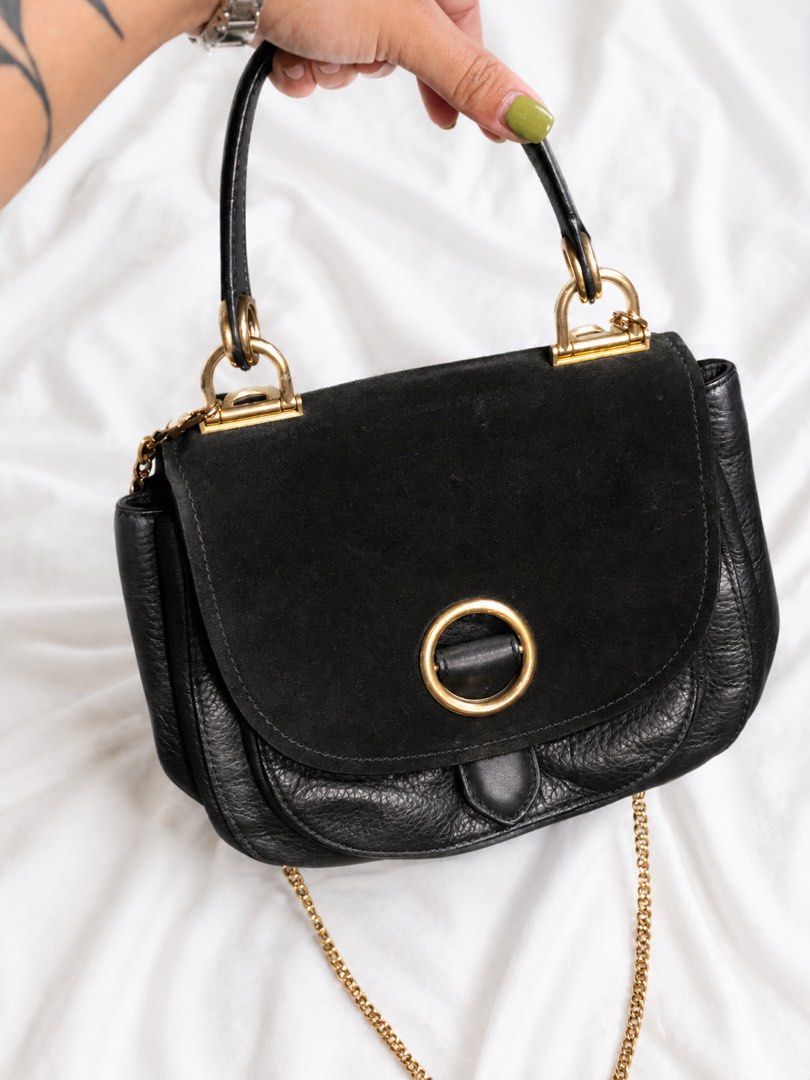 MK Black Leather Quilted Chain Shoulder Bag (Category: Luxury Bags & Wallets) located in Cainta. Submitted by cetairesvintage (Listing ID 1446079931, Image 2). Description: MK KORRA BAG NOTE: the chains is not the original I lost it - Elegant gold hardware - Stylish quilted pattern on front flap - Versatile top handle and long gold chain strap - Ideal for both everyday use and nights out.
