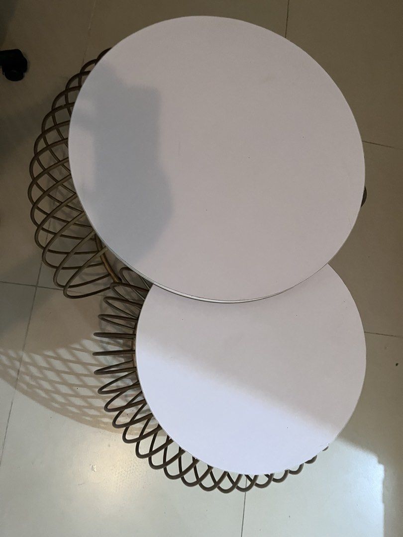 Modern Nesting Coffee Tables - White & Gold (Category: Tables & Sets) located in Quezon City. Submitted by fromfairydust (Listing ID 1446023155, Image 2). Description: - Set of 2 round nesting coffee tables - White tabletop with gold wire base - Smaller table nests under larger one for space-saving - Modern aesthetic for any living room - Send your offers so we can negotiate.