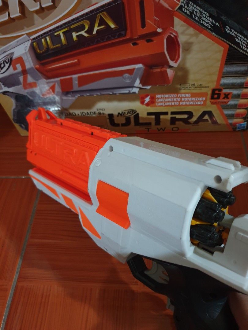 Nerf Ultra Two Blaster with Darts (Category: Action & Battle Toys) located in Las Pinas. Submitted by anggesmart (Listing ID 1446003259, Image 3). Description: - Nerf Ultra Two blaster - Color: White and Orange - Includes 6 Ultra darts - Comes in original box - Ideal for outdoor play.