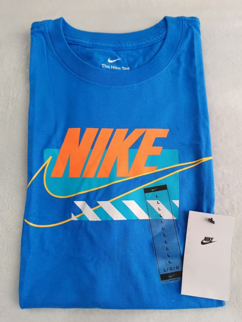 Nike Blue Graphic T-Shirt Size L (Category: Tshirts & Polo Shirts ) located in Quezon City. Submitted by shinereign (Listing ID 1446085076, Image 2). Description: - Cool blue Nike t-shirt - Classic Nike logo with graphic overlay - Ideal for everyday casual wear - Comfortable and stylish addition to your wardrobe.