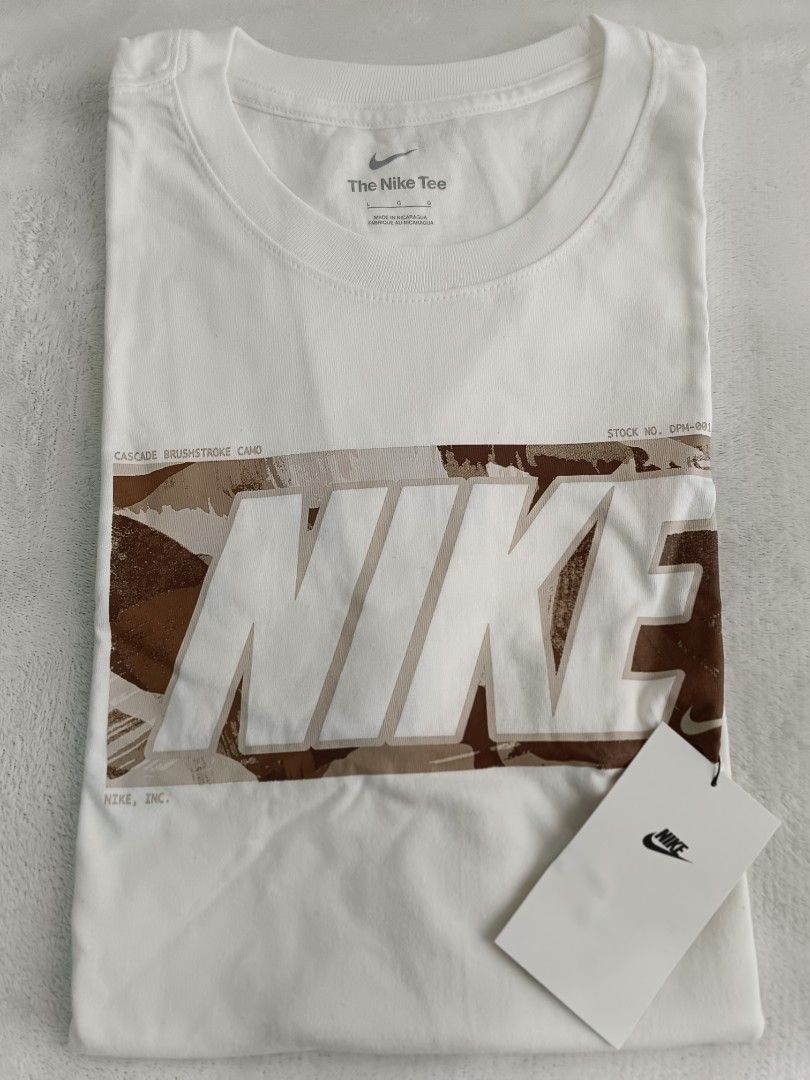 Nike White Camo Logo T-Shirt (Category: Tshirts & Polo Shirts ) located in Quezon City. Submitted by shinereign (Listing ID 1446084948, Image 2). Description: - Brand: Nike - Color: White - Design: Desert camo box logo - Fit: Standard - Sleeves: Short - Size: Tag indicates Small (please check measurements) - Condition: Brand new with original tags attached - Style: Casual wear - Origin: Philippines.