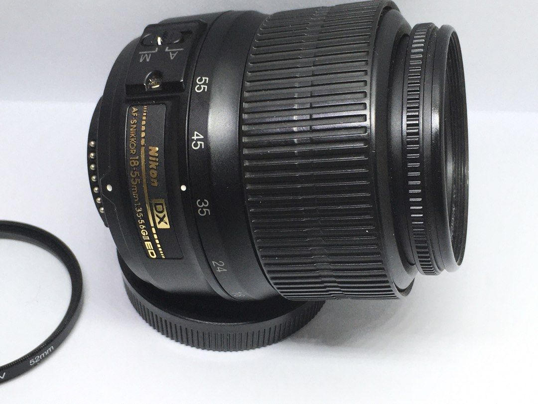 Nikon 18-55 DX lens (Category: Lens & Kits) located in Las Pinas. Submitted by film101 (Listing ID 1446107494, Image 3). Description: Nikon DX AFS nikkor 18-55 f3.5-5.6 GII ED BOUGHT IN HK‼️‼️ Its 2006 ver lens in good working condition Optics good No fungus Smooth focusing Inclusion filter ring and rear cap (generic)only .