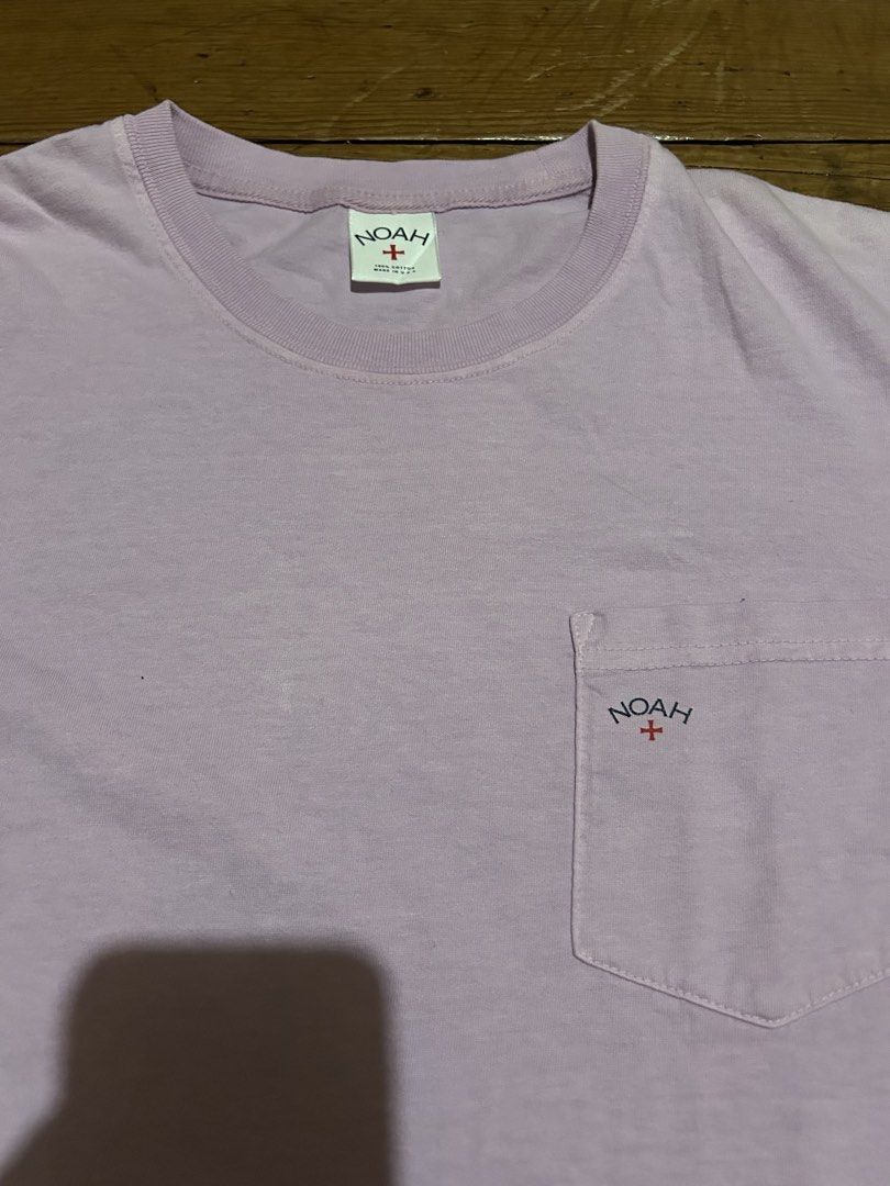 NOAH Pocket T-Shirt Lavender Size M (Category: Tshirts & Polo Shirts ) located in Baguio. Submitted by don_ben (Listing ID 1446124059, Image 2). Description: - NOAH Lavender Pocket Tee - Size: Medium (M) - Features embroidered logo on chest pocket - Embroidered logo on back neck tag - Made in USA - Care Instructions: Machine wash warm with like colors, tumble dry medium. Do not iron if decorated. - Dimensions: 19 x 28.