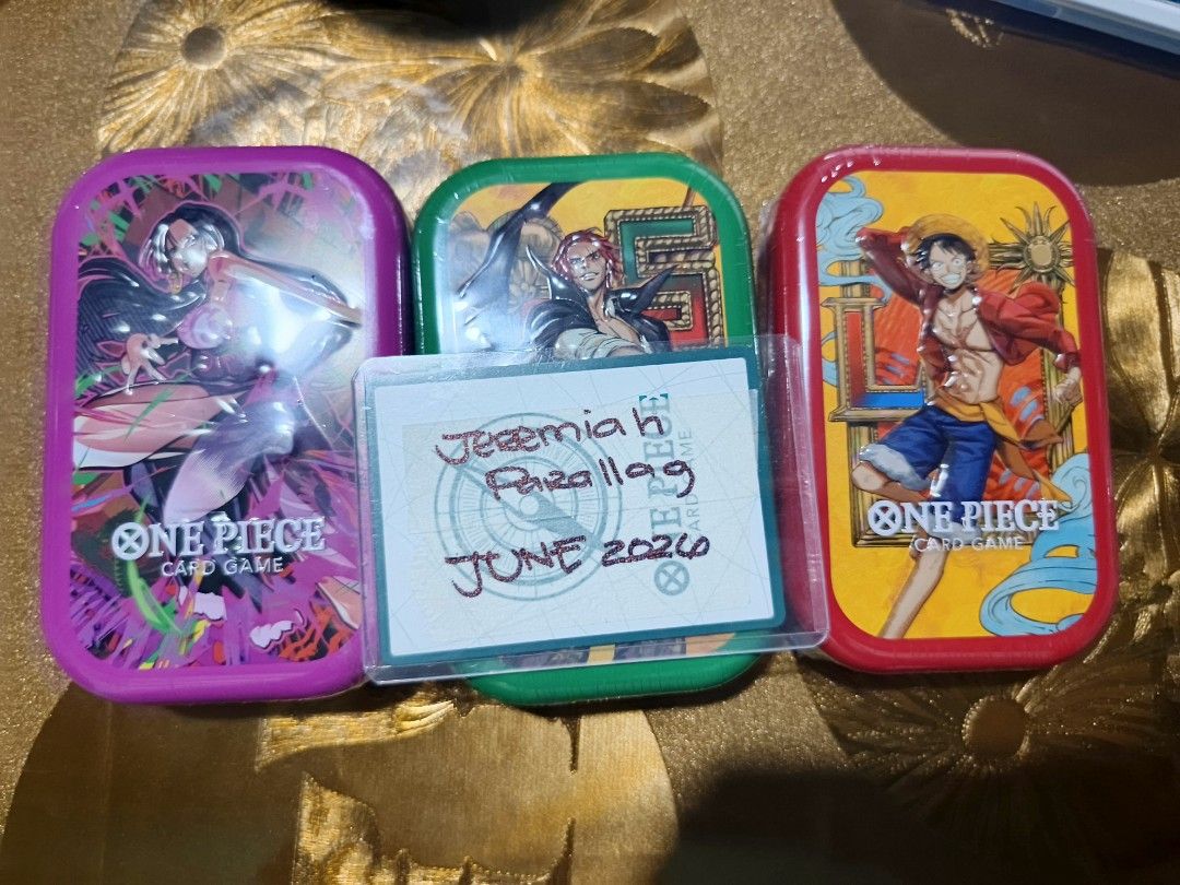 One Piece TS03 Tins and Loose Packs (Category: Vintage Collectibles) located in Bacoor. Submitted by jayprllg (Listing ID 1446037270, Image 1). Description: Selling One Piece TS03 tins and promos - Sealed tins (boa, luffy and shanks) > 18k per set (pink boa) / 18.5k (purple boa) - Promo Cards (sealed) and tins only > 14.5k per set (pink boa) / 15k ( purple boa) Loose Packs OP16 (From TRU) - 280 per pack / 250 each if take all / 6 pcs available OP