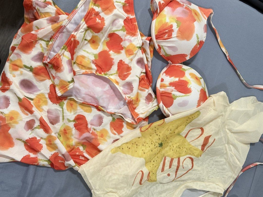 Orange Floral 4-in-1 Bikini Set (M) (Category: Bikinis & Swimsuits) located in Malabon City. Submitted by jennyace (Listing ID 1446036142, Image 2). Description: - 4-in-1 bikini set from Bliss - Vibrant floral print - Includes: bikini top, bikini bottoms, skirt, sheer mesh top with starfish design - Perfect for beach days and pool parties - Mix and match for versatile looks.