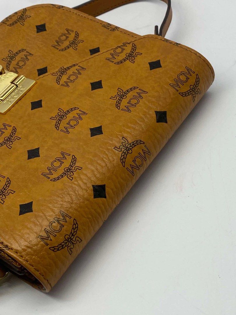 original Mcm cognac sling bag (Category: Cross-body Bags) located in Quezon City. Submitted by jhen141414 (Listing ID 1445997605, Image 3). Description: almost new condition. money back guaranteed if proven fake. we have physical store in timog we have page in fb. we do live monday-friday.