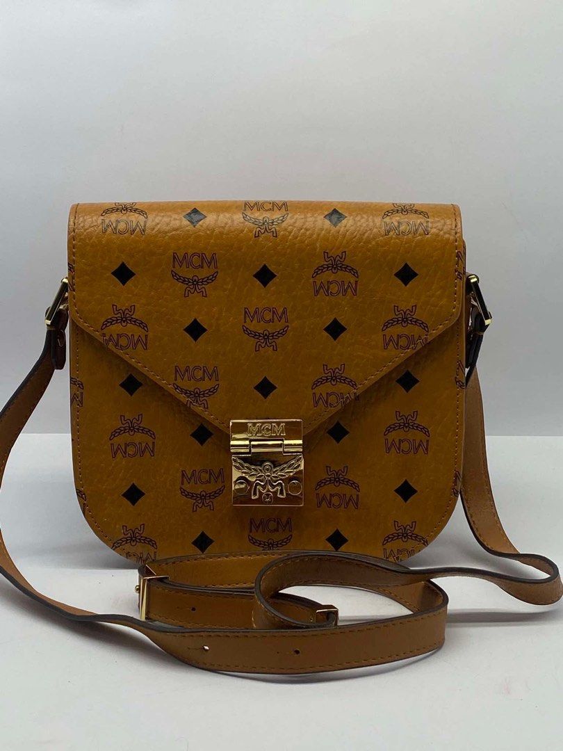 original Mcm cognac sling bag (Category: Cross-body Bags) located in Quezon City. Submitted by jhen141414 (Listing ID 1445997605, Image 1). Description: almost new condition. money back guaranteed if proven fake. we have physical store in timog we have page in fb. we do live monday-friday.