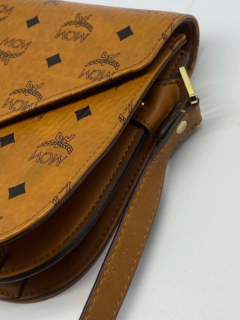 original Mcm cognac sling bag (Category: Cross-body Bags) located in Quezon City. Submitted by jhen141414 (Listing ID 1445997605, Image 2). Description: almost new condition. money back guaranteed if proven fake. we have physical store in timog we have page in fb. we do live monday-friday.