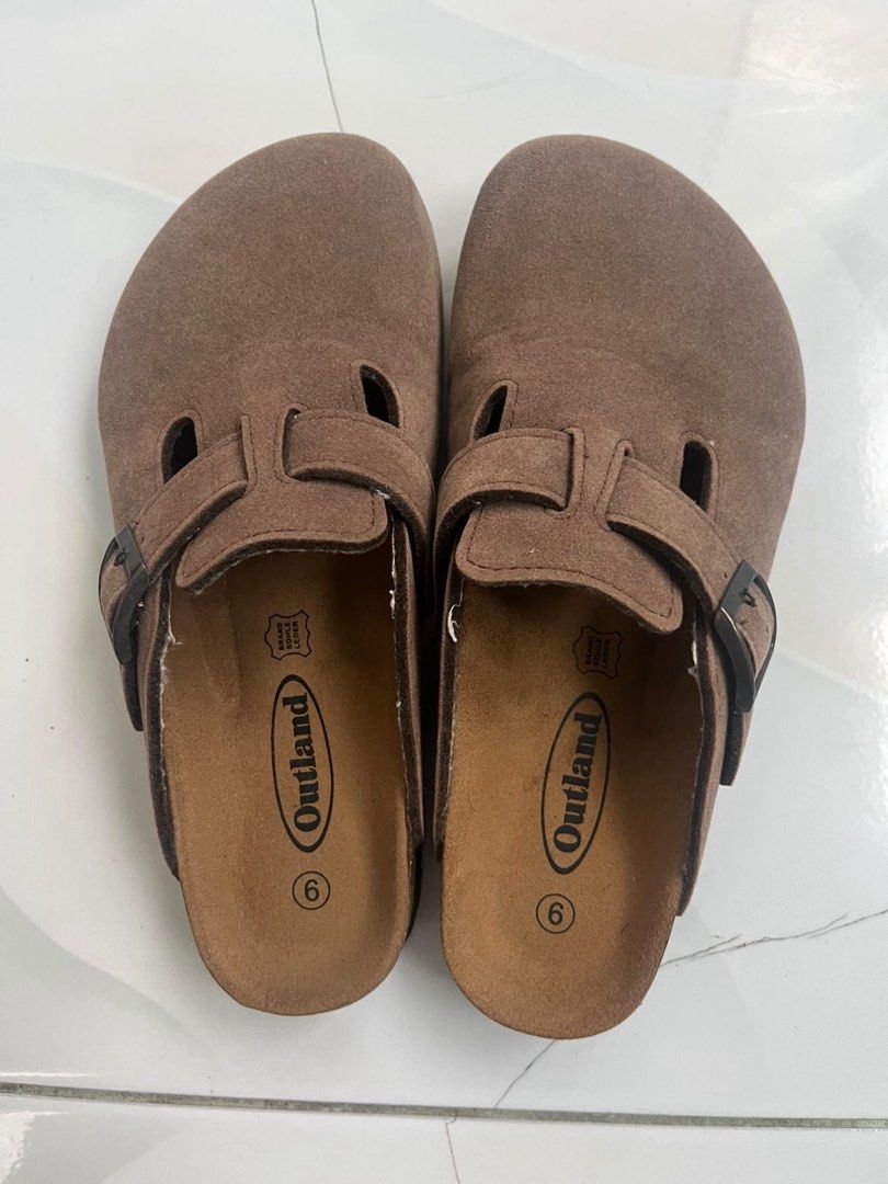 Outland Savannah Choco Brown Suede Clogs (Category: Slippers and slides) located in Manila. Submitted by deemnglcmt (Listing ID 1446120717, Image 1). Description: - Outland clogs in choco brown suede - Size 6 - Adjustable strap with buckle - Comfortable cork sole - Used only once - Affordable & Negotiable (mura na to, check the price sa pics).