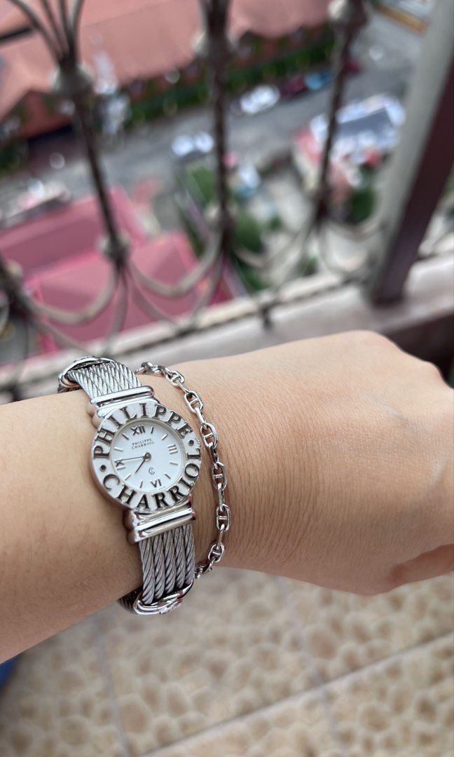 Philippe Charriol (Category: Luxury Watches) located in Manila. Submitted by sis_irene (Listing ID 1432260392, Image 1). Description: - Authentic Philippe Charriol - Silver-tone stainless steel cable bracelet - White watch face - Roman numeral hour markers - Water resistant - Swiss Made .