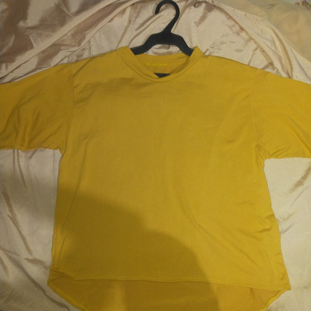 Plain Yellow T-shirt (Category: Shirts) located in Taguig. Submitted by ellaiiuu (Listing ID 1446038134, Image 1). Description: This free item is provided free of charge with the purchase of any two clothing items from my active listings. Length - 55 cm Width - 46 cm - Basic yellow t-shirt - Stretchable - Medium sleeves - Crew neck - Comfortable for everyday wear Disclaimer: Product color may slightly vary due to photographic lighting sources..