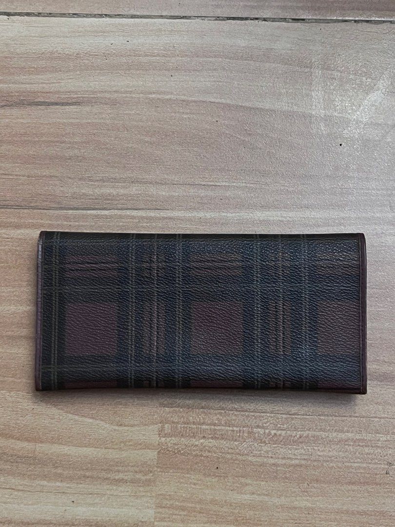 Polo Ralph Lauren Plaid Long Wallet (Category: Wallets & Card holders) located in Victorias. Submitted by lan1877 (Listing ID 1446099832, Image 2). Description: - Polo Ralph Lauren long wallet - Classic plaid pattern with leather trim - Multiple card slots - Clear ID window - Gold-tone hardware with Polo Ralph Lauren logo plate - Stylish and practical for everyday use.