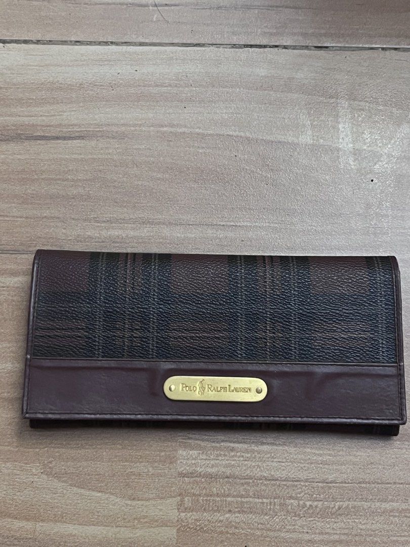 Polo Ralph Lauren Plaid Long Wallet (Category: Wallets & Card holders) located in Victorias. Submitted by lan1877 (Listing ID 1446099832, Image 1). Description: - Polo Ralph Lauren long wallet - Classic plaid pattern with leather trim - Multiple card slots - Clear ID window - Gold-tone hardware with Polo Ralph Lauren logo plate - Stylish and practical for everyday use.